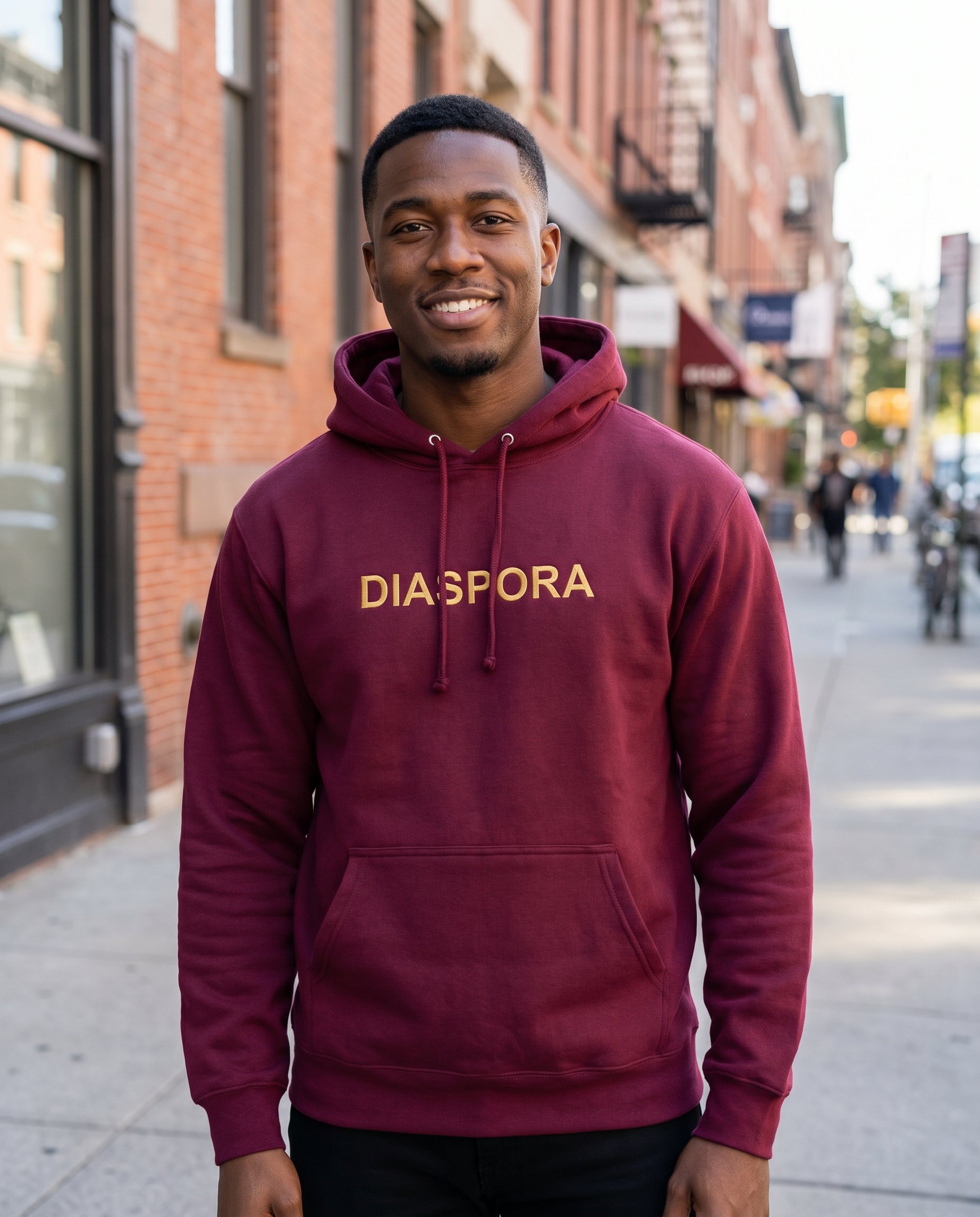 Diaspora Embroidered Hoodie — lifestyle photo | Origins Clothing Co